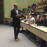 Paul Jones speaking in front of students in a lecture hall