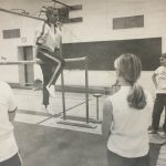 Tamara Bompa coaching students in gymnastics