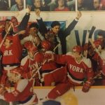 An old photo of hockey players cheering
