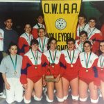 An old photo of Women\'s Volleyball Team with their medals