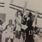 An old photo of female basketball players jumping for the ball