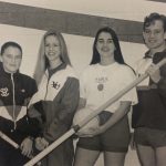 An old photo of four athletes