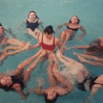 A photo of a Women\'s synchro team in a pool