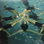 A photo of Women\'s synchro team in a swimming pool