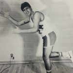 An old photo of a male athlete making a pose