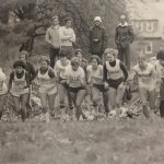 An old photo of female runners from various universities in race