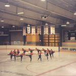 A photo of female figure skaters practicing
