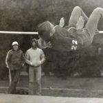 An old photo of a female athlete pole vaulting