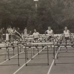 An old photo of runners in track and field hurdles
