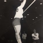 An old photo of a female volleyball player hitting back a ball