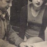 An old photo of a man and a woman reading something
