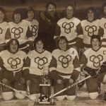An old photo of of Yeowomen hockey team with their trophy