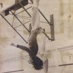 A different shot of an old photo of a female gymnast practicing on a balance beam