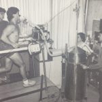 An old photo of a man running on a treadmill during a physical test