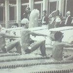 An old photo of swimmers getting ready to start the race