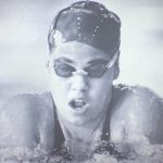 A frontal shot of a female swimmer