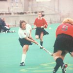 A photo of people playing field hockey