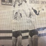 An old photo of female volleyball players jumping for a ball