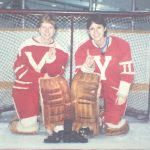An old photo of two female hockey goalies posing for the photo