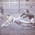 An old photo of male athletes playing rugby