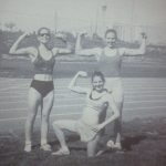 An old photo of three female athletes doing a pose