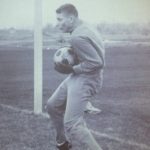 An old photo of a goalie holding a soccer ball