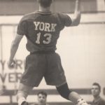 Photo of a York athlete jumping for the volleyball