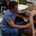 ATC Grad and Faculty member Mike Boni measuring an athlete\'s leg