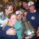 ATC Grads holding the Grey Cup