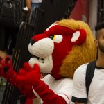 A close shot of the York Lion mascot cheering students on