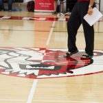 A shot of the indoor gym floor with the York Lion logo