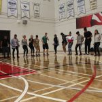 Students participating in an activity by jumping