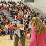 The head referee laughing during a student activity