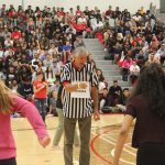 The head referee pointing at a student during an activity