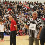 Merv Mosher and the head referee amidst the students
