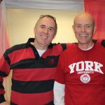 Merv Mosher smiling with a man in red and black striped shirt on Red & White Day 2014