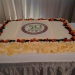 A frontal shot of a 50th anniversary cake on a table