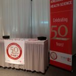 A table with 50th anniversary sign and banner